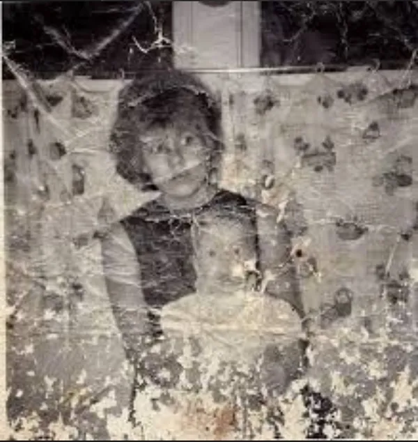 AI-generated Heavily Damaged Old Family Snapshot in Faded BLack and White made with GPT Image 2