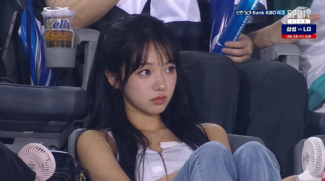 Korean baseball fan cam in natural unedited style, realistic KBO broadcast capture look (prompt by @_1000pro_)