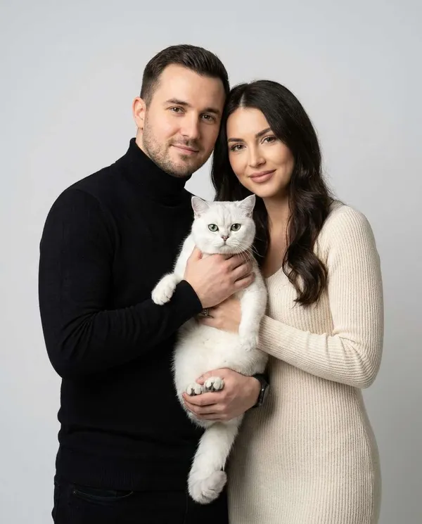 AI-generated Studio Family Portrait with a Cat made with Nano Banana Pro